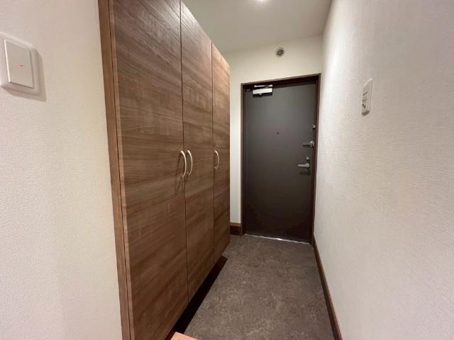 クロノス52鶴羽田（101） 玄関