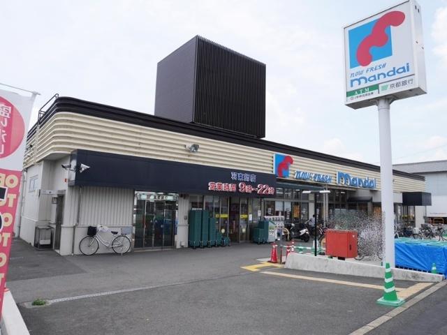 万代羽束師店：695m